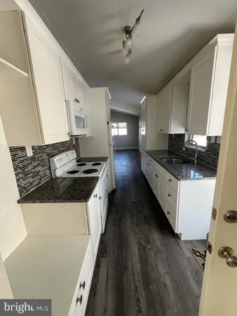 a bathroom with a sink a mirror and a shower