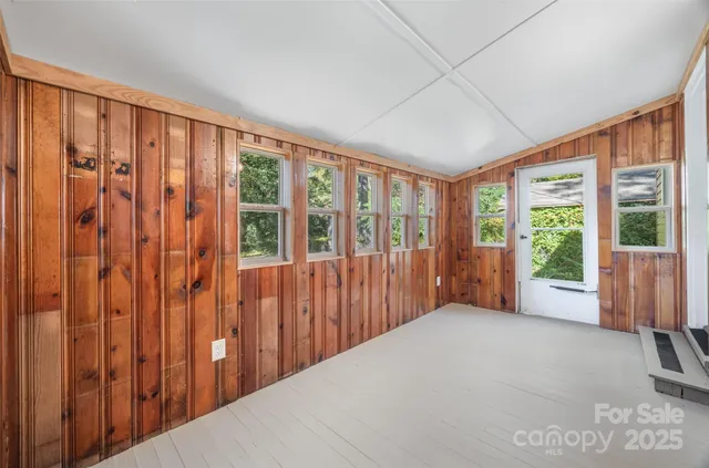 a view of a big room with a large window