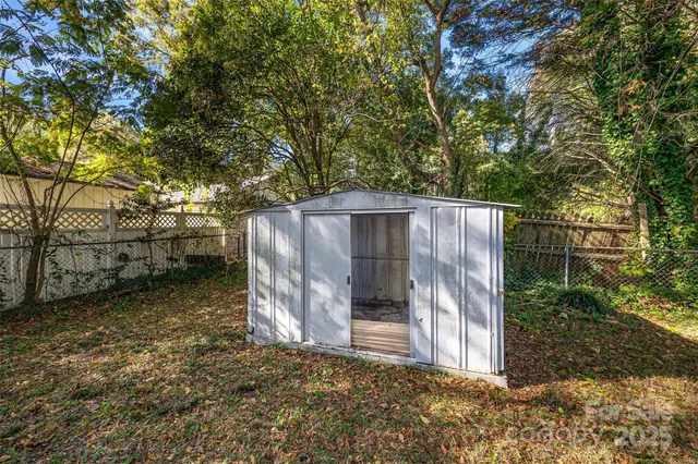 a view of a wooden fence