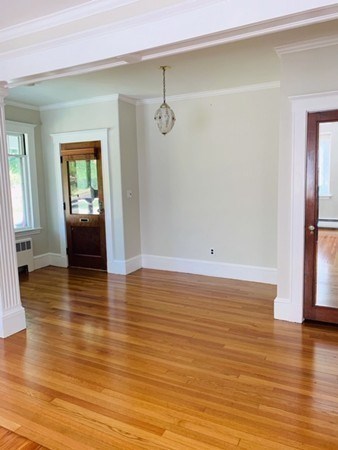 52 Powder House Boulevard, Unit 1 Somerville, MA 02144 - Photo 17 of 30 a view of a room with wooden floor and stairs