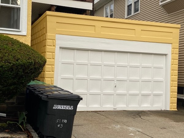 52 Powder House Boulevard, Unit 1 Somerville, MA 02144 - Photo 30 of 30 a view of a house with a large window