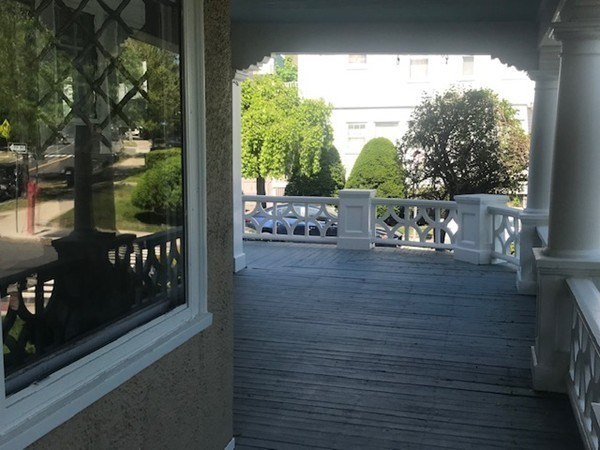 52 Powder House Boulevard, Unit 1 Somerville, MA 02144 - Photo 5 of 30 a view of a balcony with chairs