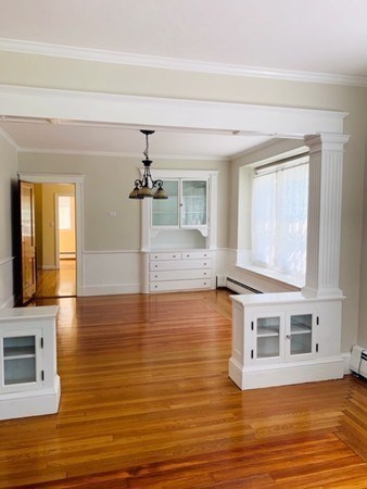 52 Powder House Boulevard, Unit 1 Somerville, MA 02144 - Photo 7 of 30 a view of a kitchen and an empty room