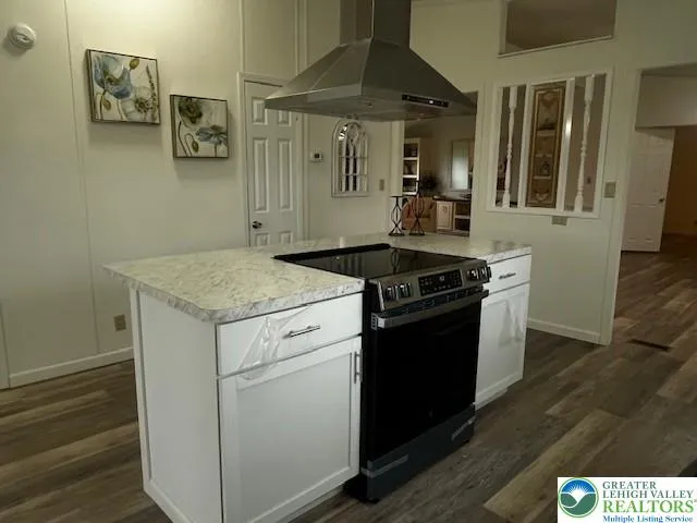 a kitchen that has a sink and a stove