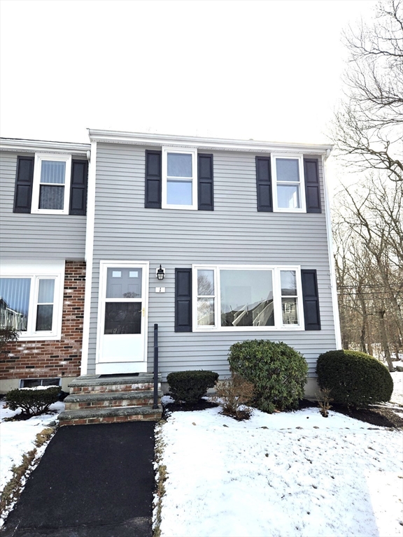 a view of a brick building next to a road