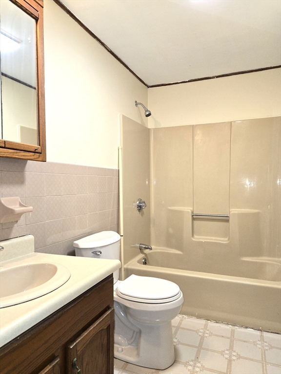 1170 Wilson Road, Unit 1 Fall River, MA 02720 - Photo 15 of 25 a bathroom with a sink a toilet and shower