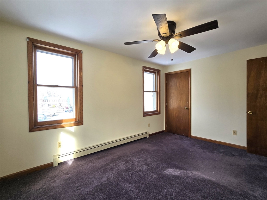 1170 Wilson Road, Unit 1 Fall River, MA 02720 - Photo 17 of 25 wooden floor in an empty room with a window