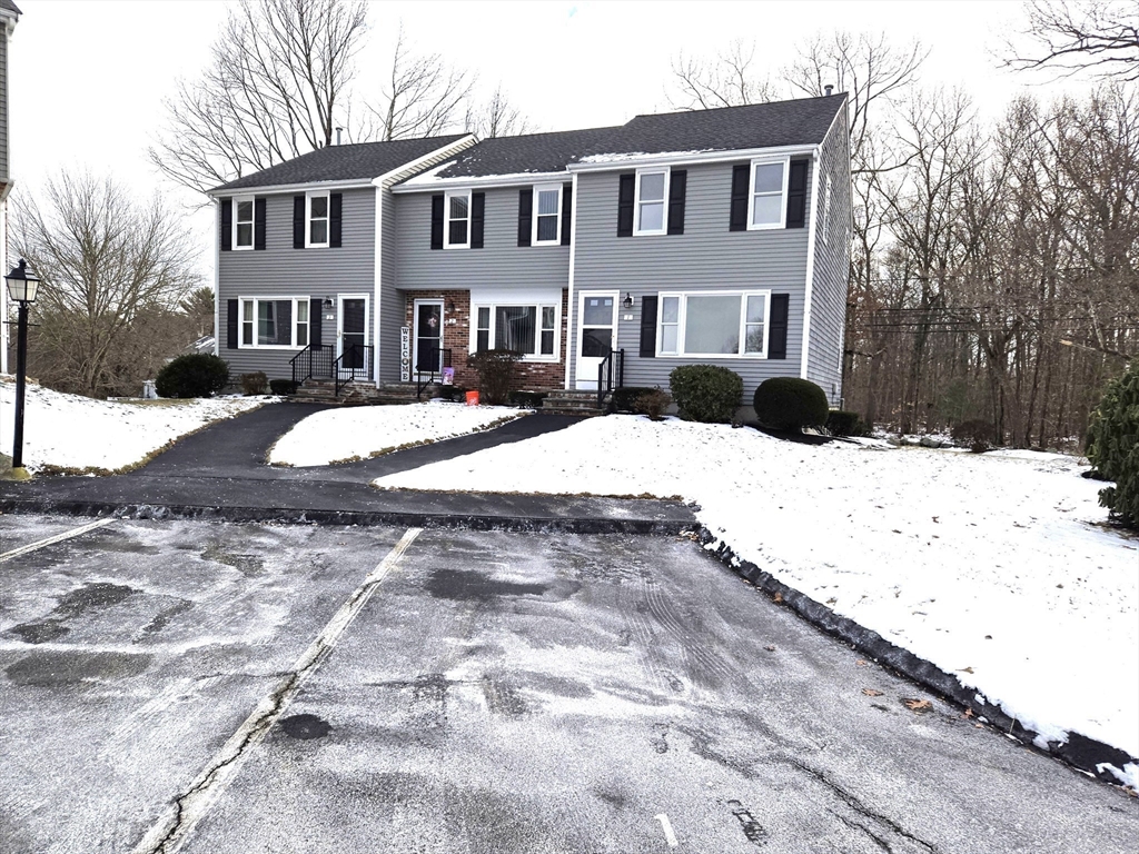 1170 Wilson Road, Unit 1 Fall River, MA 02720 - Photo 2 of 25 a front view of a house with a yard covered in snow
