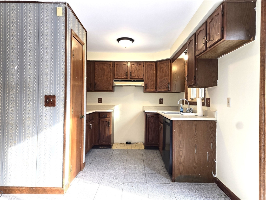 1170 Wilson Road, Unit 1 Fall River, MA 02720 - Photo 3 of 25 a kitchen with stainless steel appliances granite countertop a refrigerator and a sink