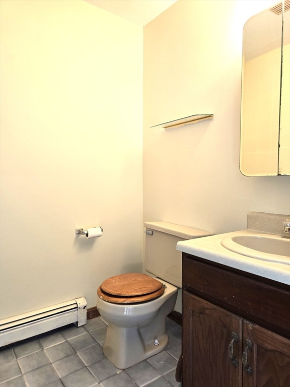 1170 Wilson Road, Unit 1 Fall River, MA 02720 - Photo 6 of 25 a bathroom with a toilet a sink and mirror