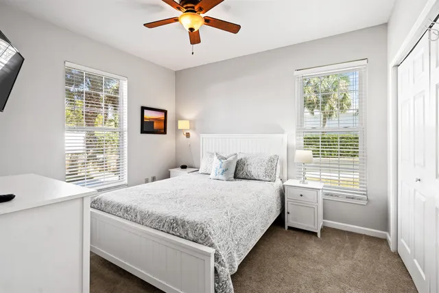 a bedroom with a large bed and a flat screen tv