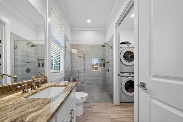 a bathroom with a sink a washer and dryer