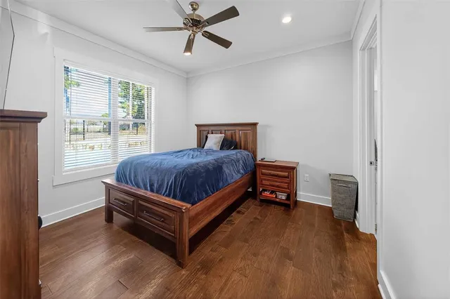 a bed sitting in a bedroom next to a window