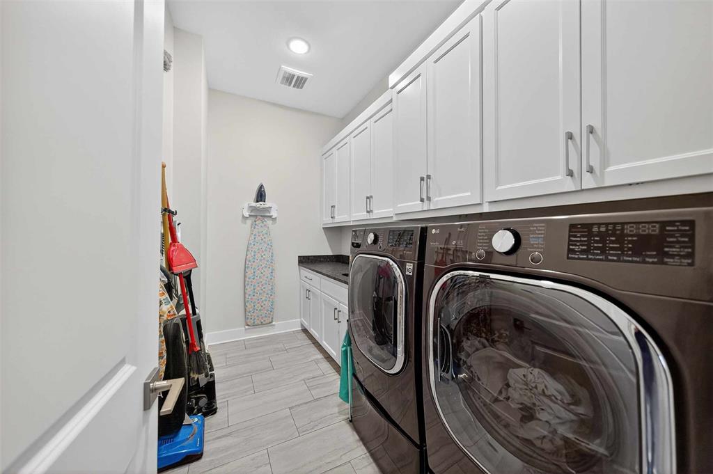 22227 Mallards Cove Bullard, TX 75757 - Photo 21 of 39 a utility room with dryer and washer