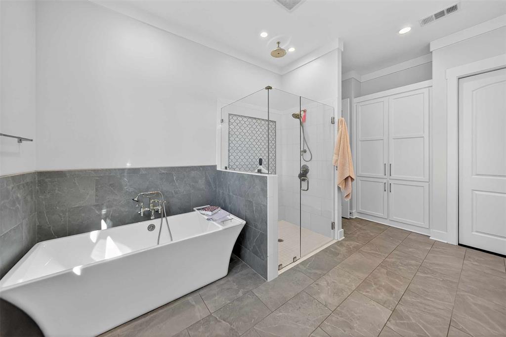 22227 Mallards Cove Bullard, TX 75757 - Photo 25 of 39 a bathroom with a bathtub and a shower