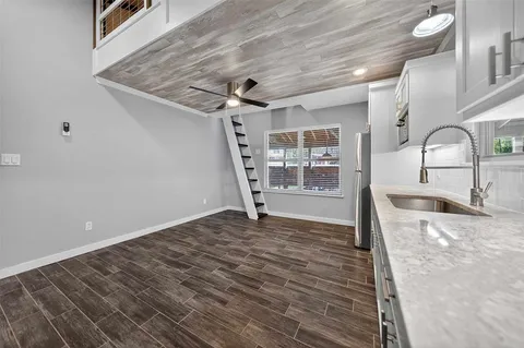 a view of a livingroom with wooden floor