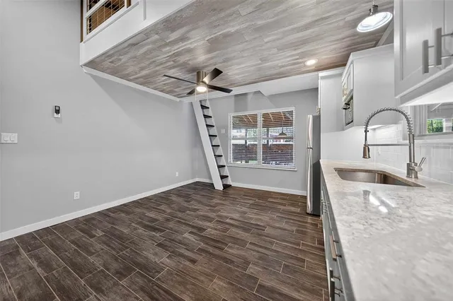 a view of a livingroom with wooden floor