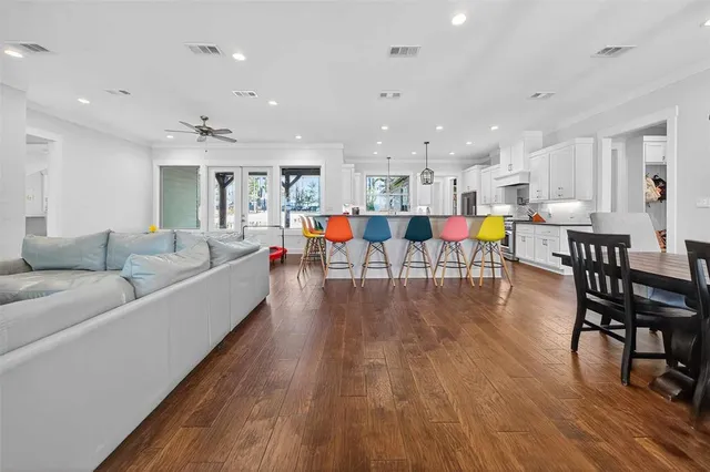 a view of a dining room with furniture and wooden floor