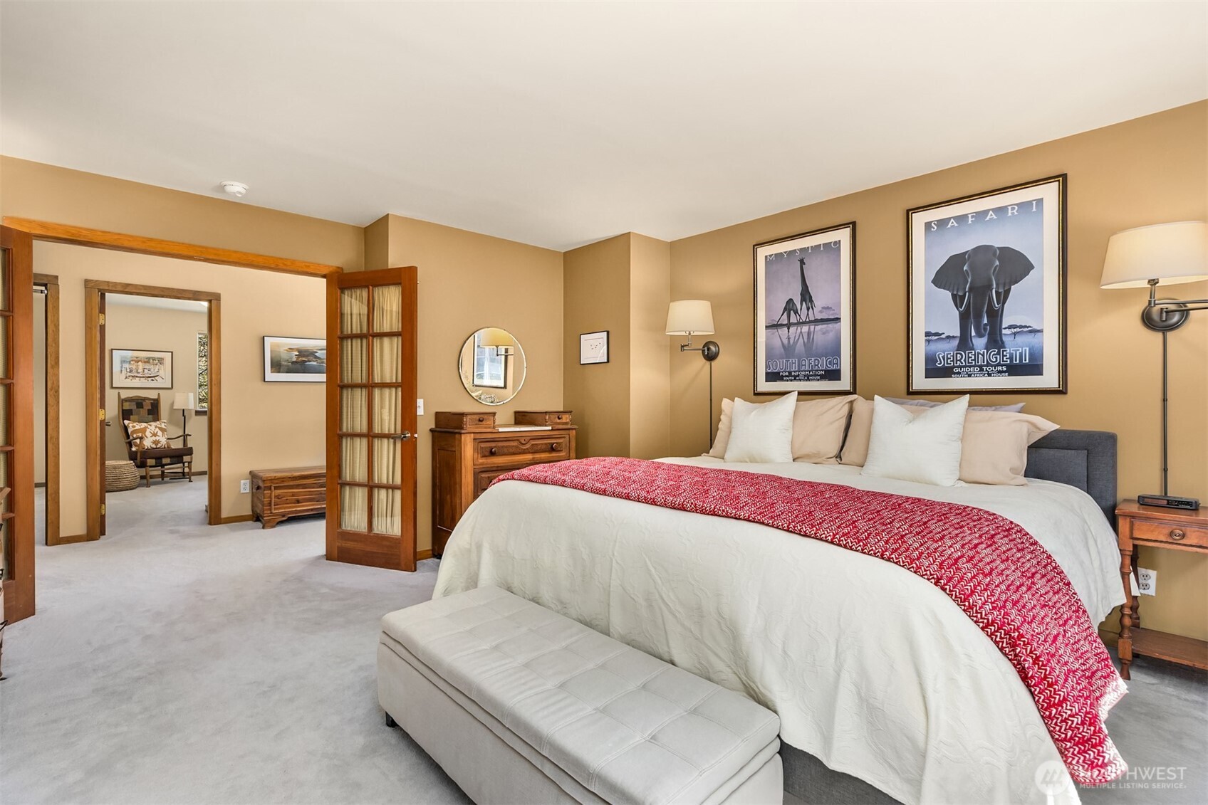 37695 Hansville Road Northeast Hansville, WA 98340 - Photo 17 of 37 a spacious bedroom with a bed and lamp