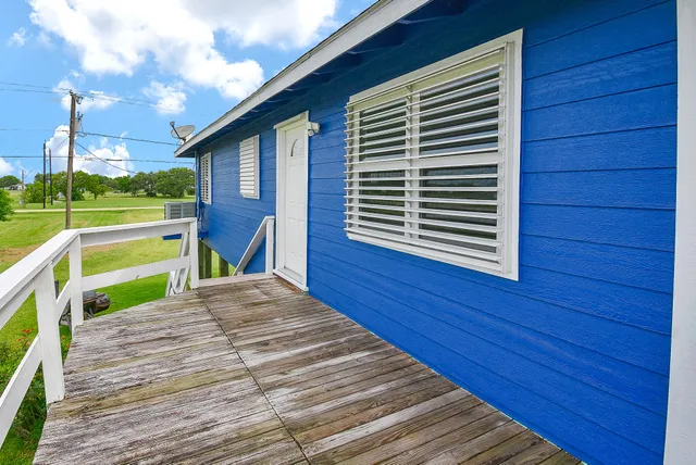 a view of backyard with cabin and wooden floor