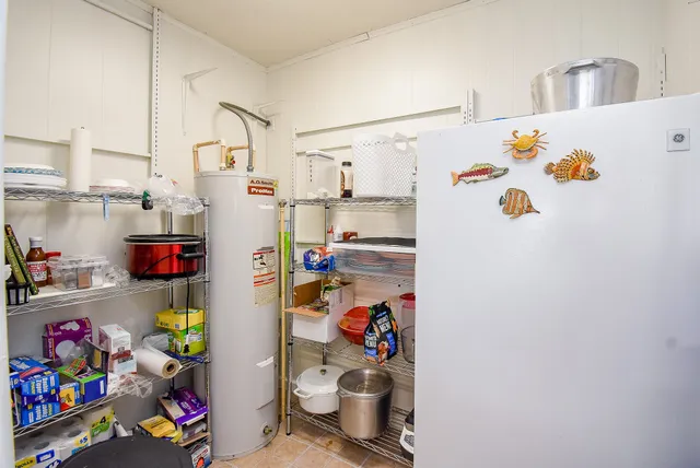 a view of a hallway with wooden floor and closet