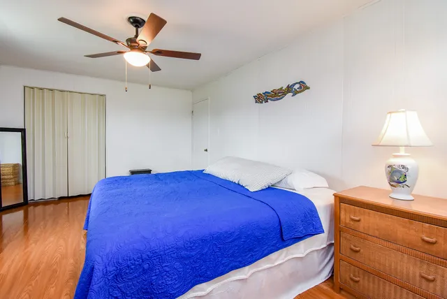 a bedroom with bed and window