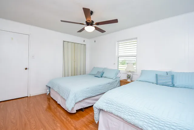 a view of hallway with wooden floor