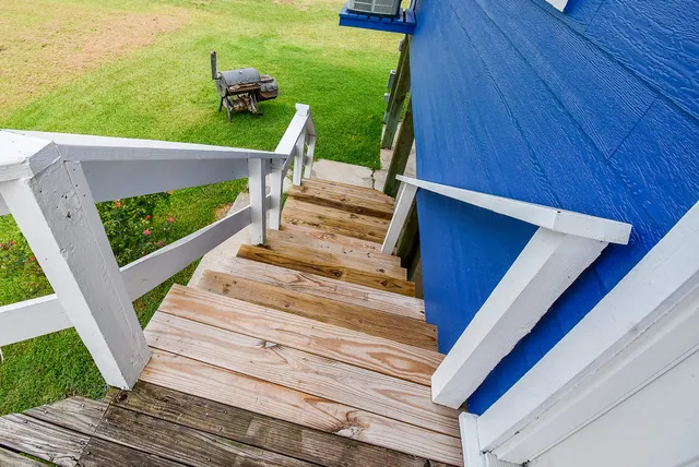 a view of a house with a table and chairs
