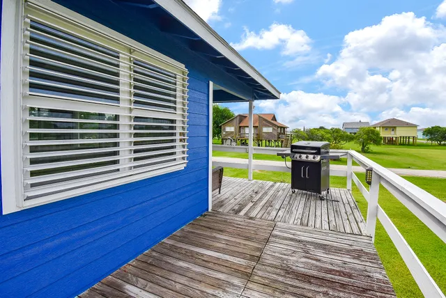 a view of a balcony with wooden floor