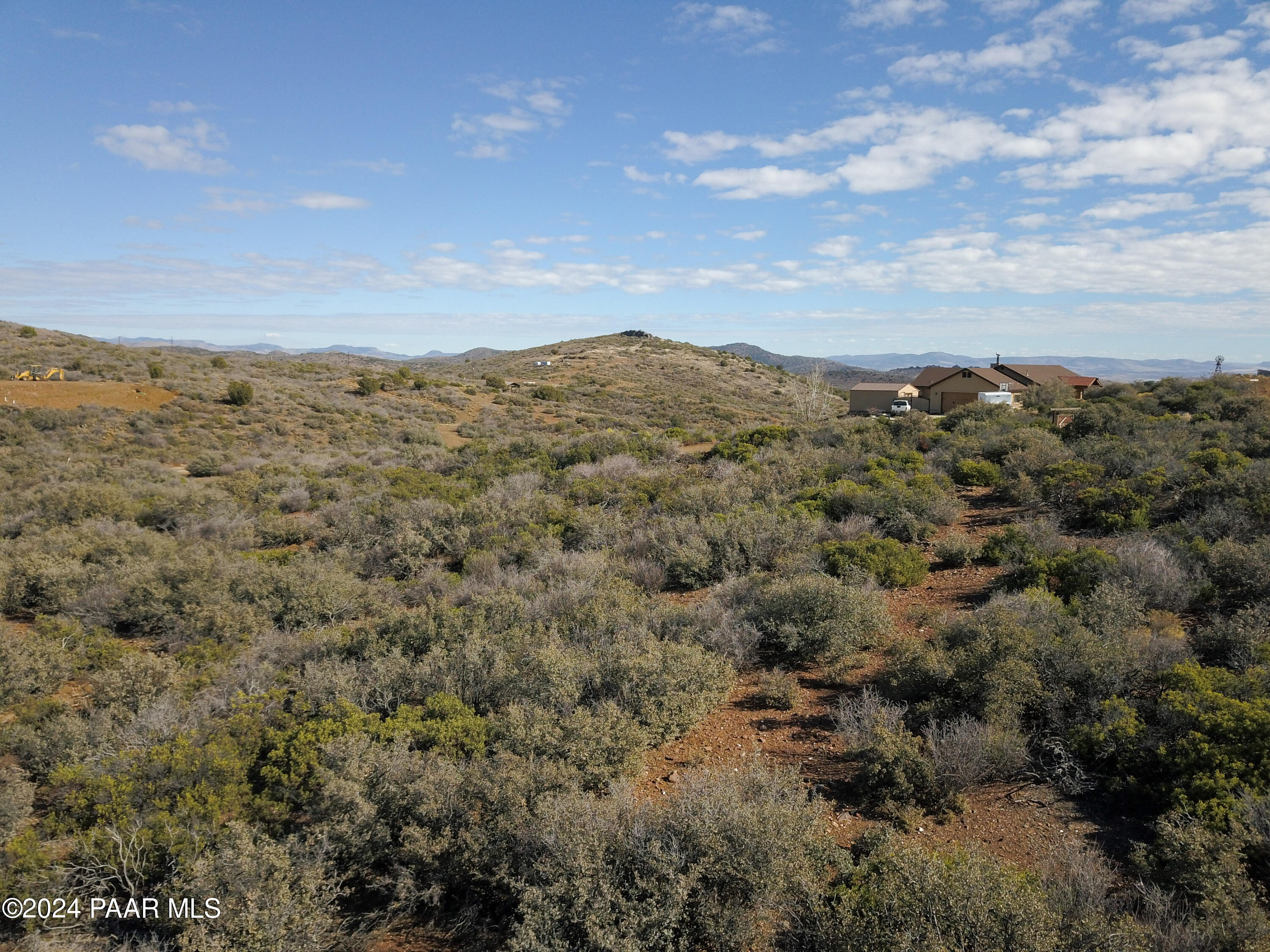 144 South Cobalt Road Mayer, AZ 86333 - Photo 8 of 29 a view of a large building with mountains in the background