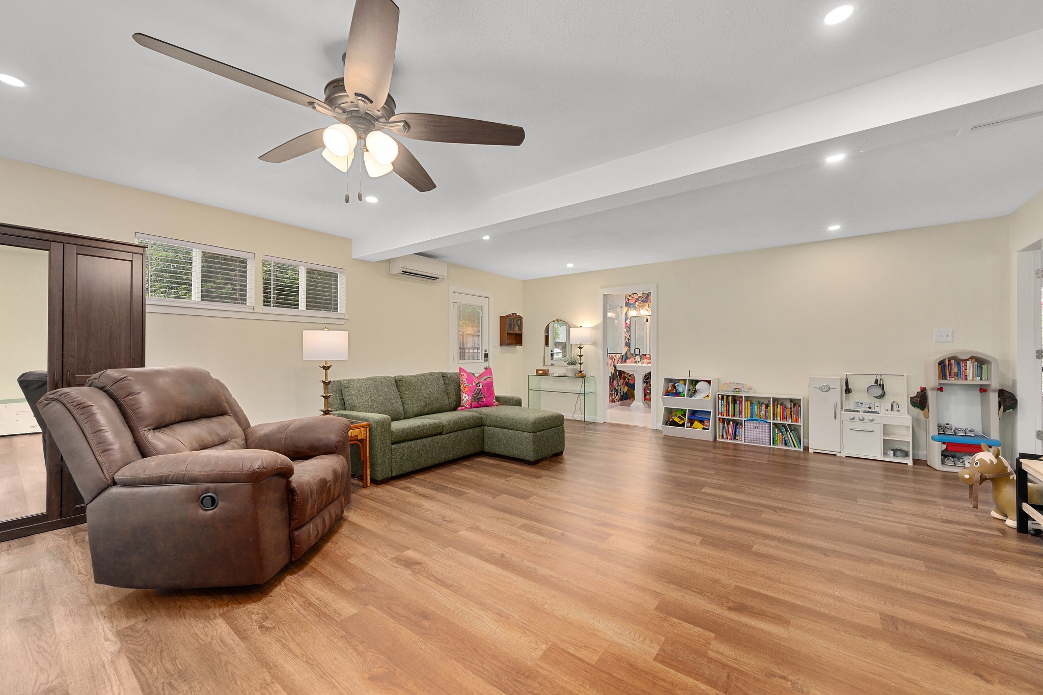509 East 17th Street Georgetown, TX 78626 - Photo 13 of 40 Recent addition includes a spacious room, full bathroom with walk-in shower, separate entrance and luxury vinyl plan flooring