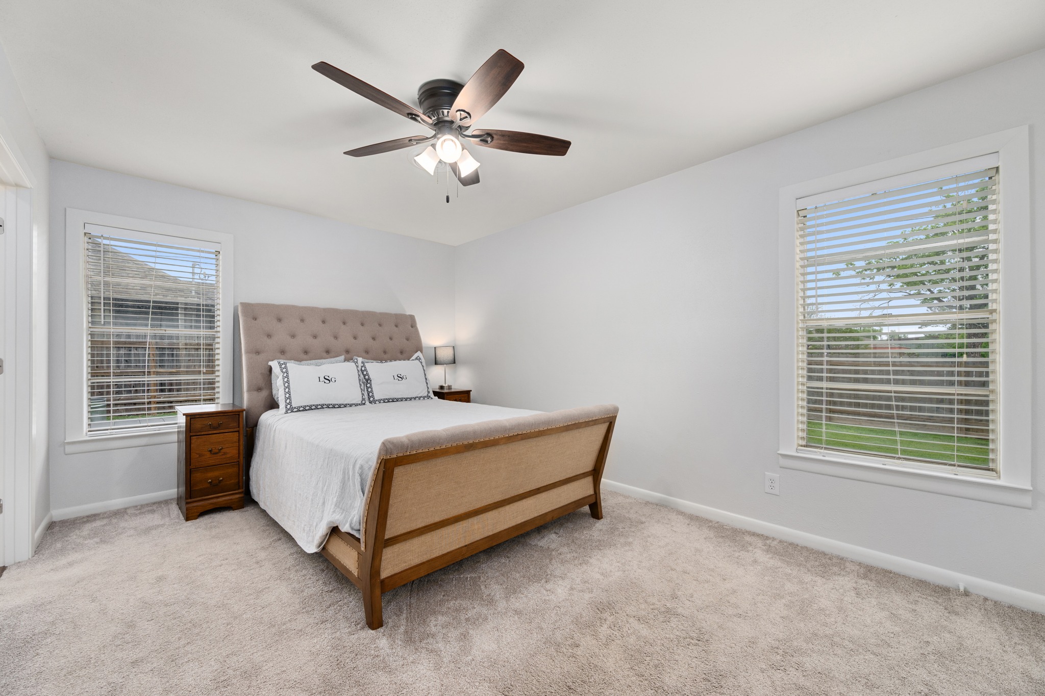 509 East 17th Street Georgetown, TX 78626 - Photo 14 of 40 Primary bedroom with ceiling fan and recent carpet