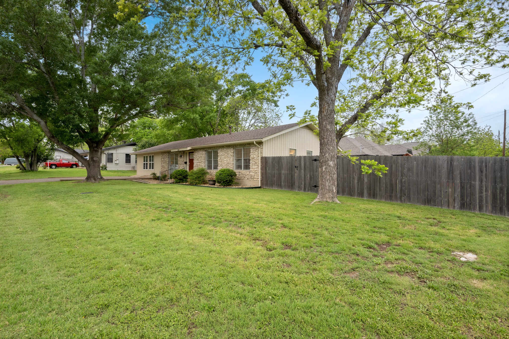 509 East 17th Street Georgetown, TX 78626 - Photo 19 of 40 Set beneath mature oak and pecan trees, this inviting home offers exceptional curb appeal and a shaded lot, perfect for those hot Texas summers