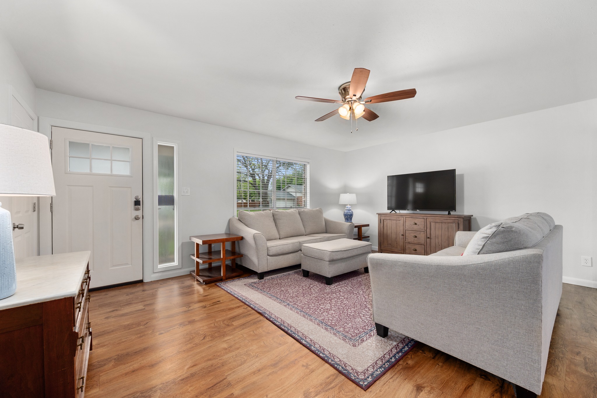 509 East 17th Street Georgetown, TX 78626 - Photo 20 of 40 Open living room with luxury vinyl plank floors and a ceiling fan