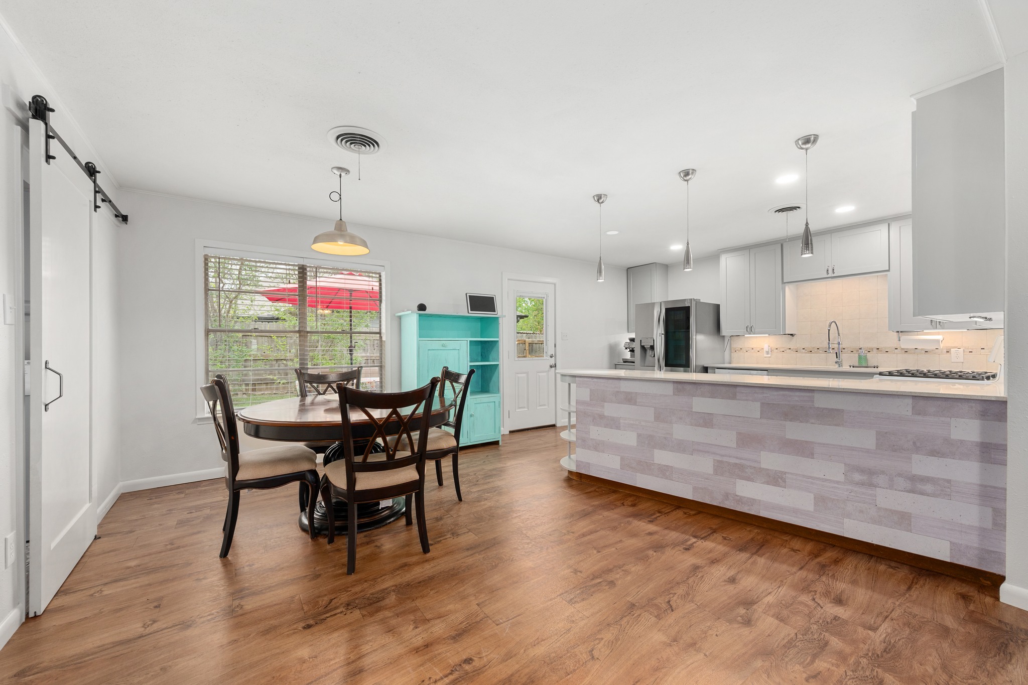 509 East 17th Street Georgetown, TX 78626 - Photo 21 of 40 Dining area open to the kitchen with a view of the backyard