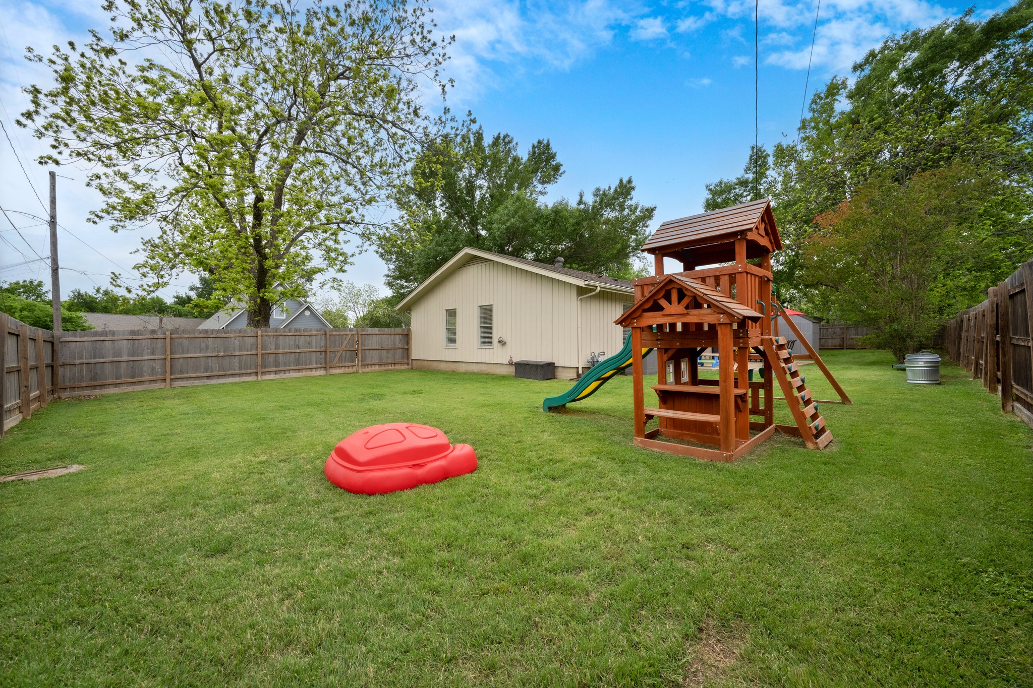 509 East 17th Street Georgetown, TX 78626 - Photo 27 of 40 The backyard is fully fenced featuring storage and a playground
