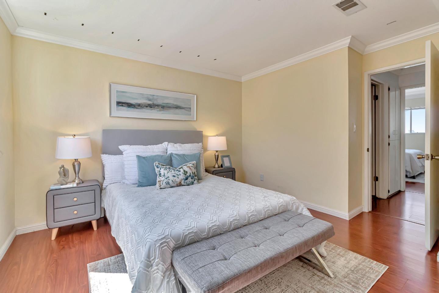 103 Muir Road Martinez, CA 94553 - Photo 21 of 33 a bedroom with a bed and wooden floor