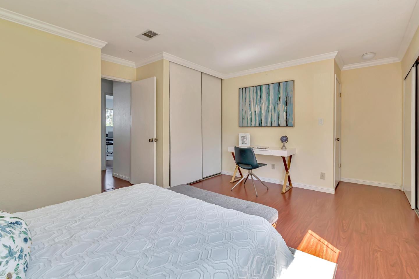 103 Muir Road Martinez, CA 94553 - Photo 22 of 33 a bedroom with a bed and a chair