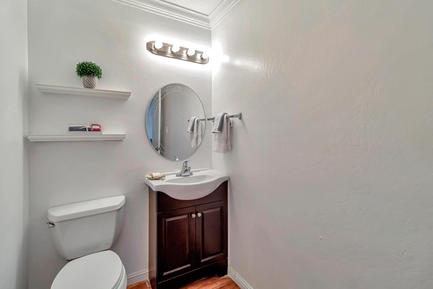 103 Muir Road Martinez, CA 94553 - Photo 25 of 33 a bathroom with a toilet a sink and mirror