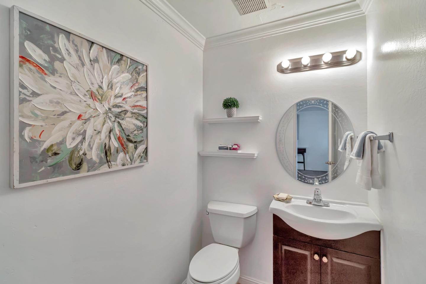 103 Muir Road Martinez, CA 94553 - Photo 26 of 33 a bathroom with a toilet sink and mirror