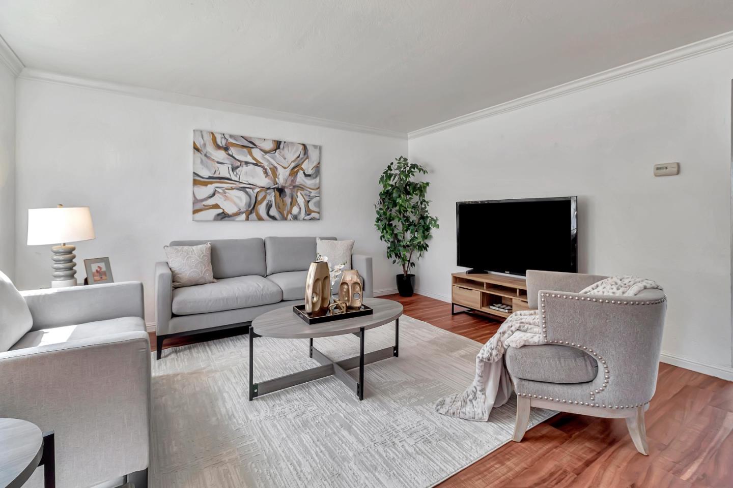 103 Muir Road Martinez, CA 94553 - Photo 4 of 33 a living room with furniture and a flat screen tv