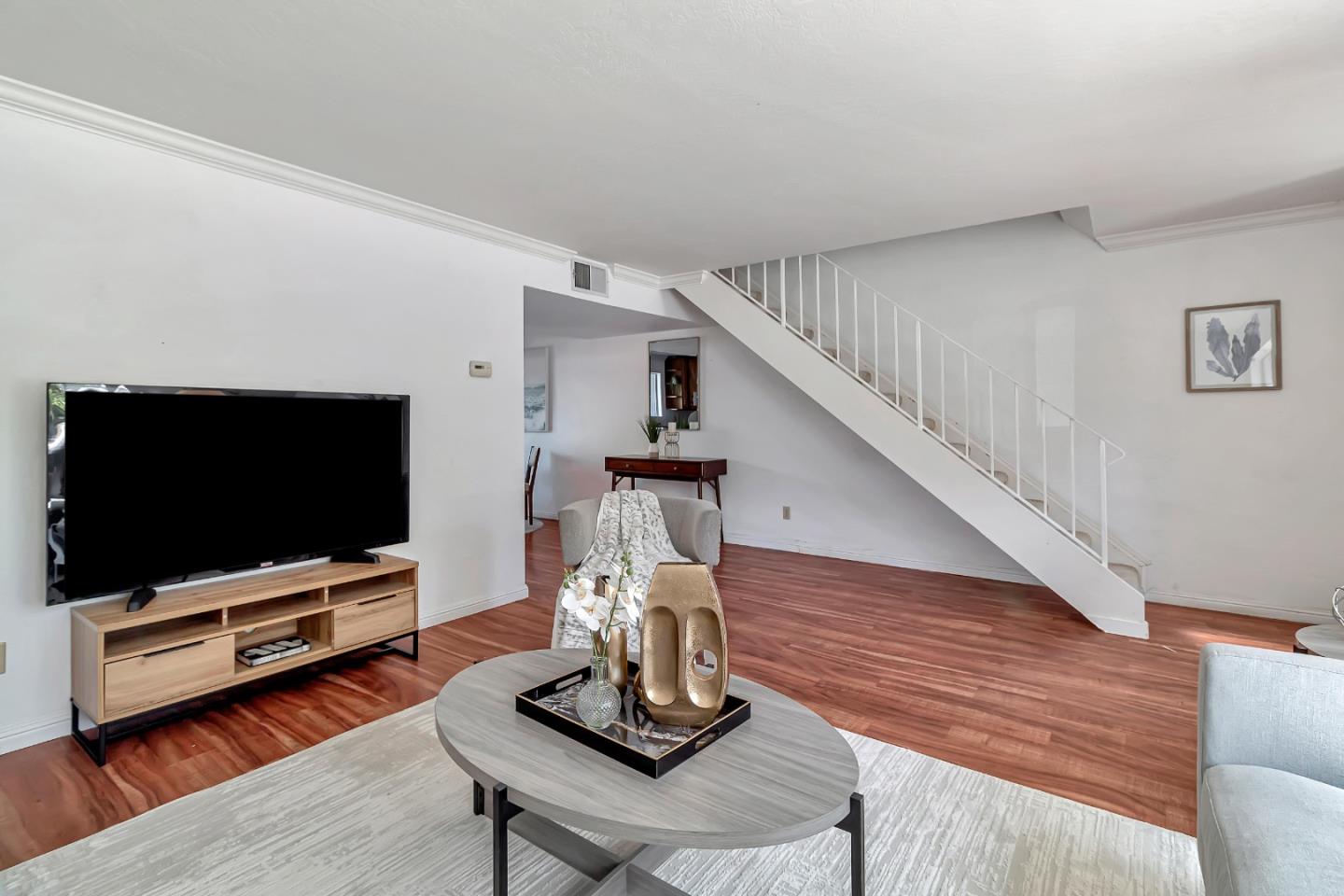 103 Muir Road Martinez, CA 94553 - Photo 7 of 33 a living room with furniture and a flat screen tv