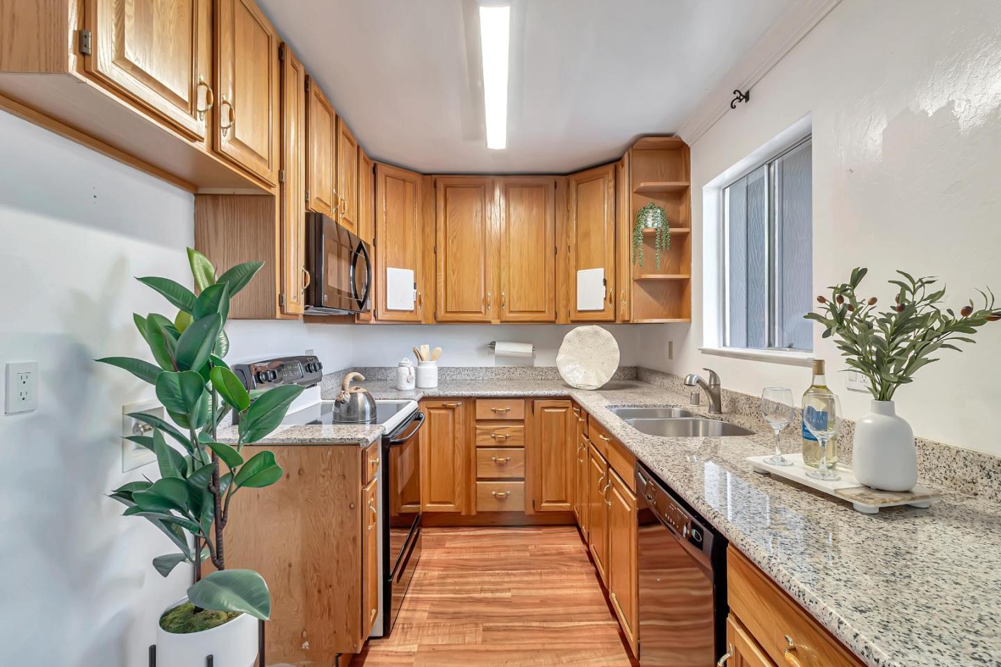 103 Muir Road Martinez, CA 94553 - Photo 9 of 33 a kitchen with a potted plant on the counter