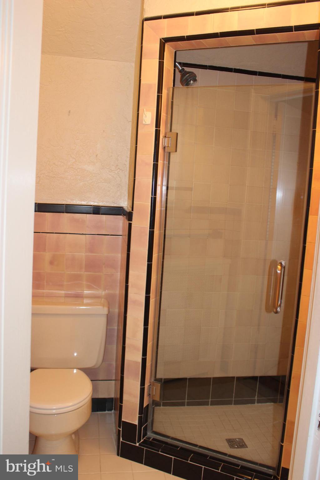 534 Kenwood Road Drexel Hill, PA 19026 - Photo 16 of 28 a bathroom with a toilet and a shower