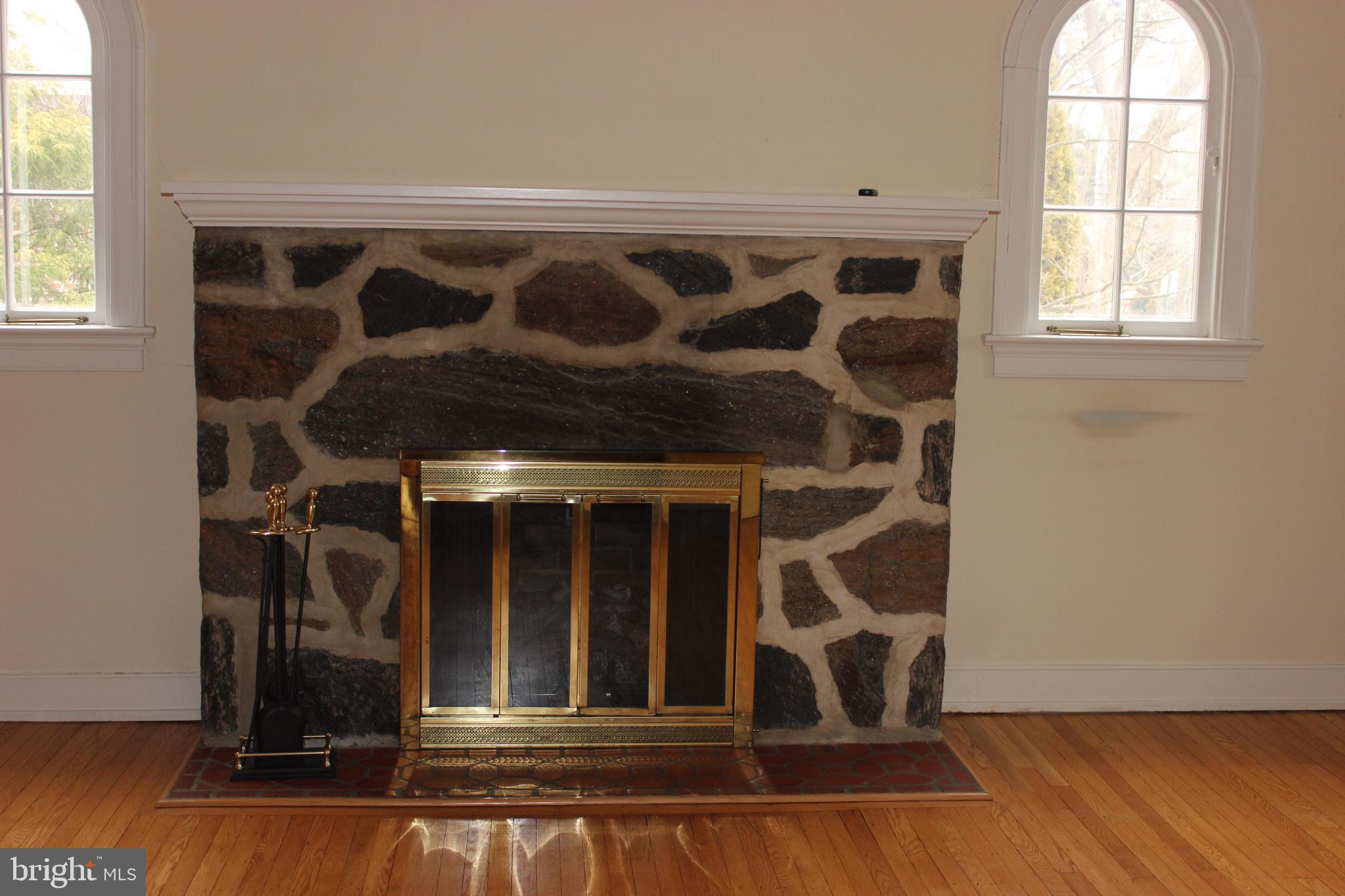 534 Kenwood Road Drexel Hill, PA 19026 - Photo 5 of 28 a view of an empty room with wooden floor and windows