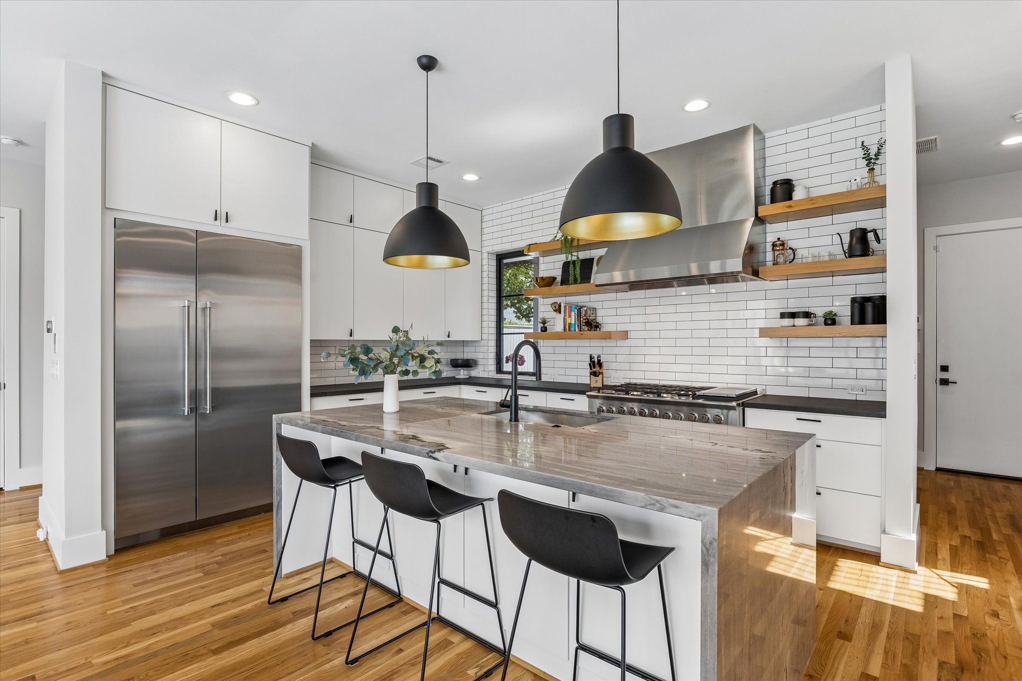 2705 Julian Street Houston, TX 77009 - Photo 17 of 50 The kitchen island has storage underneath as well as outlets for maximum functionality