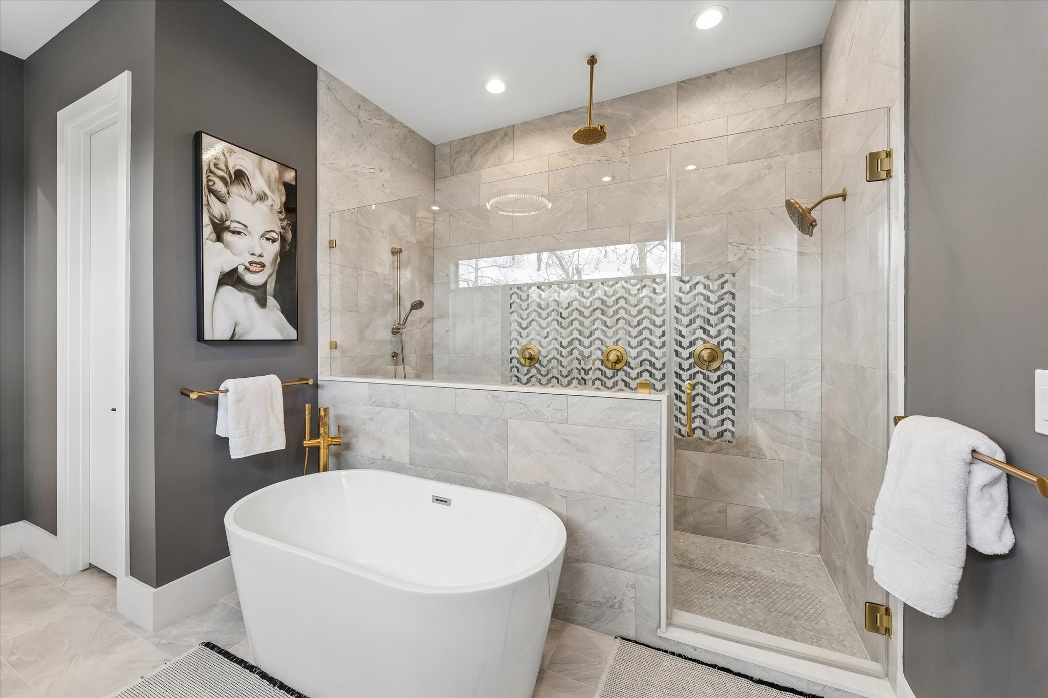 2705 Julian Street Houston, TX 77009 - Photo 28 of 50 Large primary shower with 3 showerheads and a bench. Large soaking tub with shower handle as well.