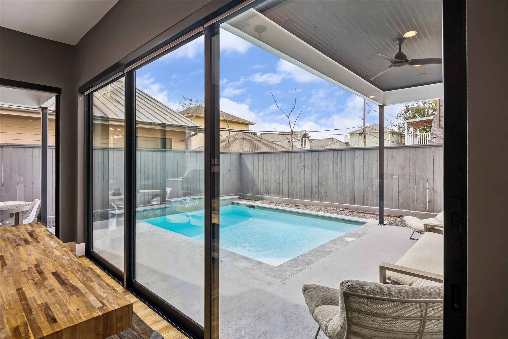 2705 Julian Street Houston, TX 77009 - Photo 47 of 50 Additional views of the pool from dinning area. You can see the pool from the entire main living space because of the large windows.