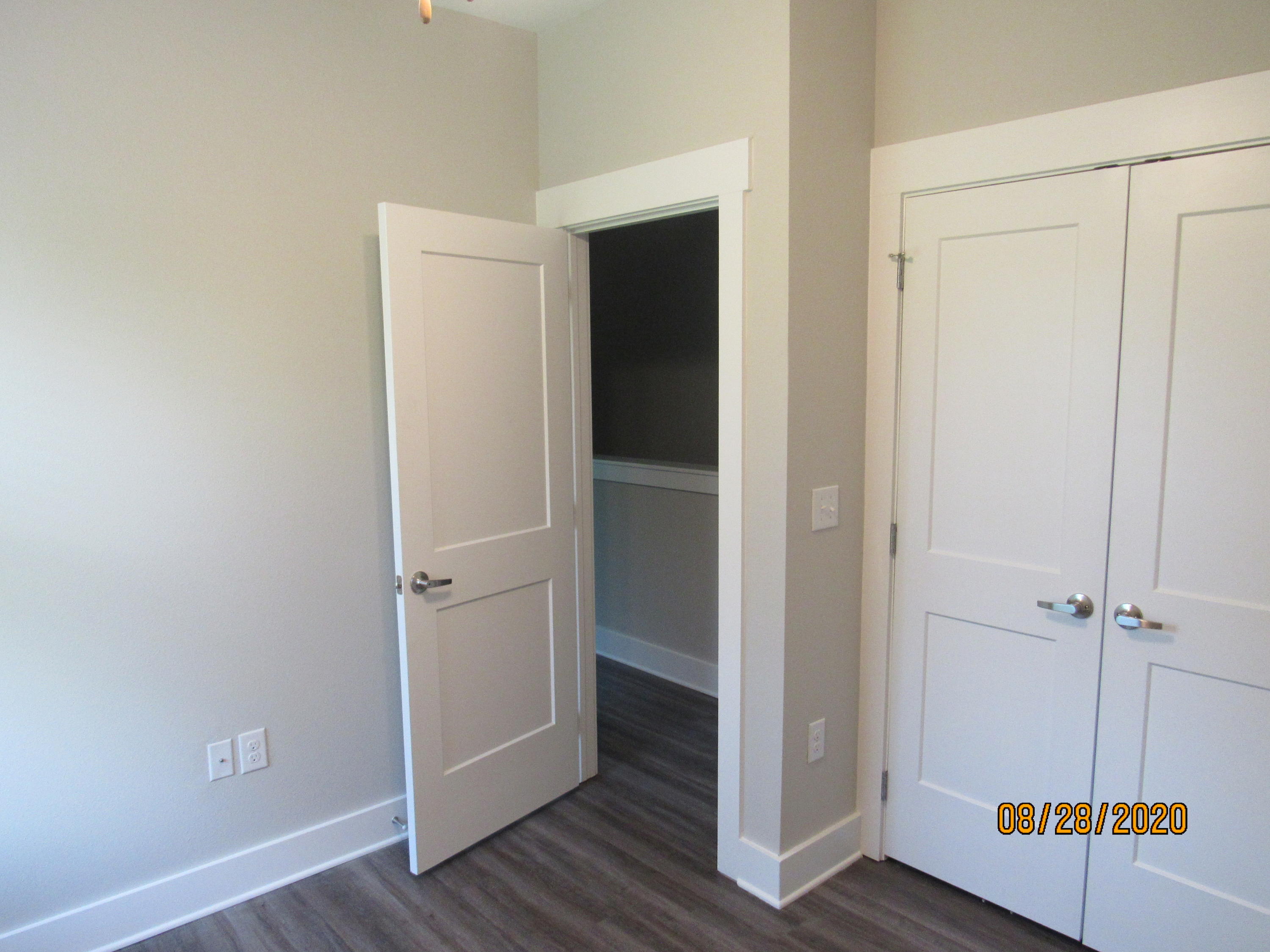 75 South Sand Palm Road Freeport, FL 32439 - Photo 13 of 18 an empty room with wooden floor and cabinet