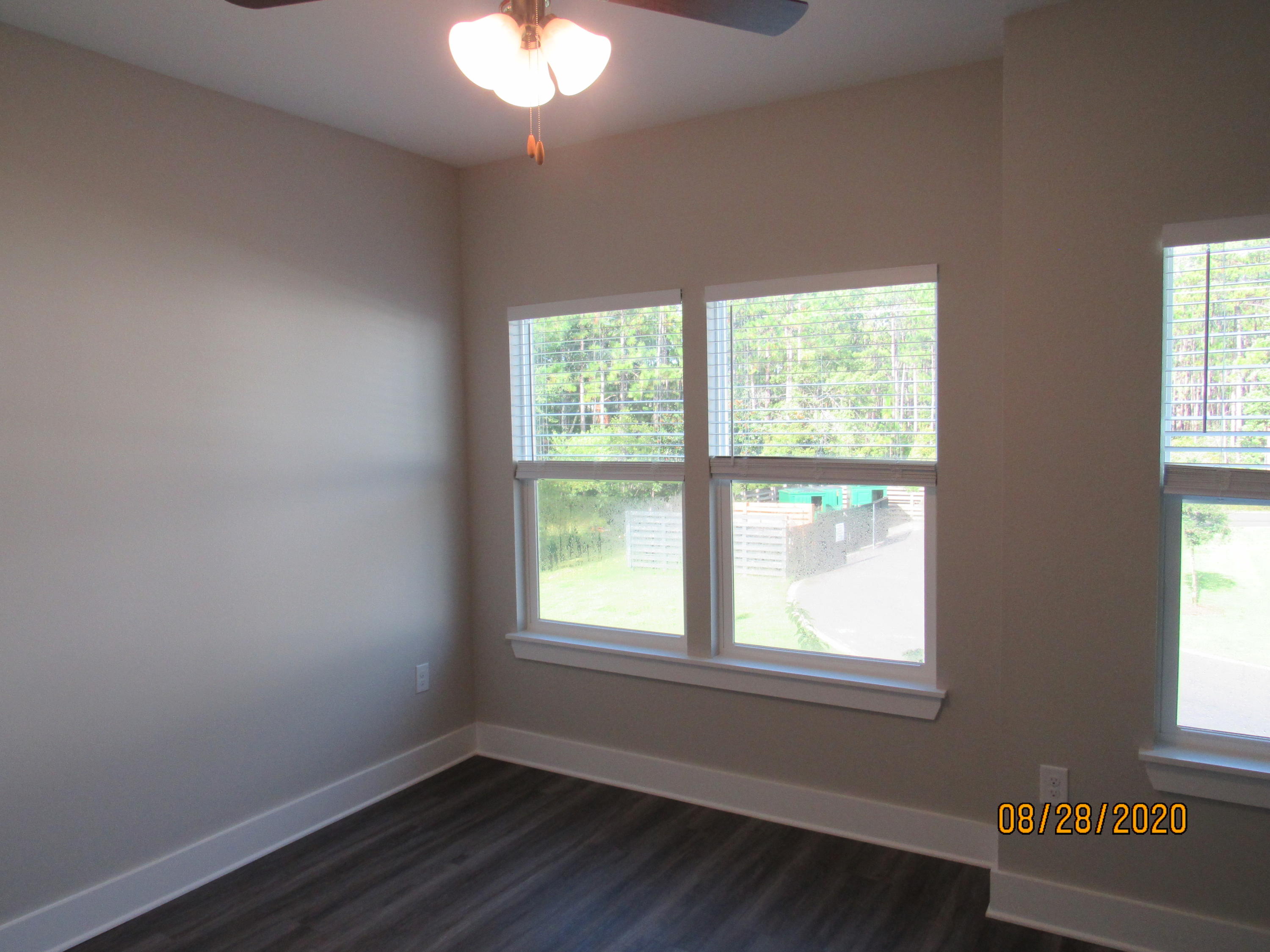 75 South Sand Palm Road Freeport, FL 32439 - Photo 15 of 18 a view of an empty room with a window and wooden floor